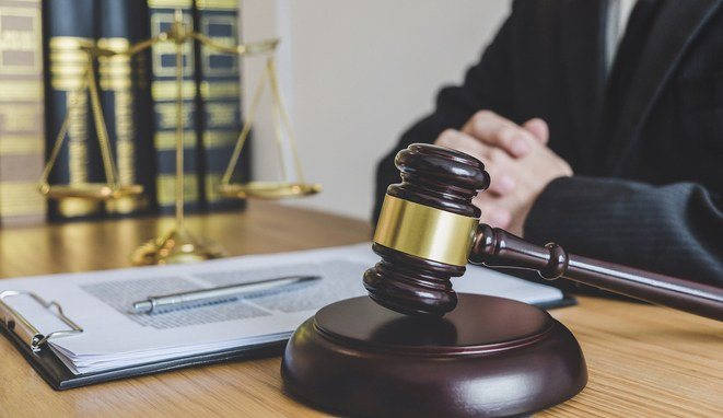 Judge gavel with scales of justice, professional male lawyers or counselor working having at law firm in office. Concepts of law