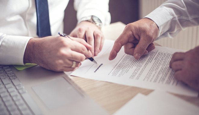 Business man signing a contract