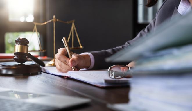 Judge gavel with Justice lawyers, Business woman in suit or lawyer working on a documents. Legal law, advice and justice concept.