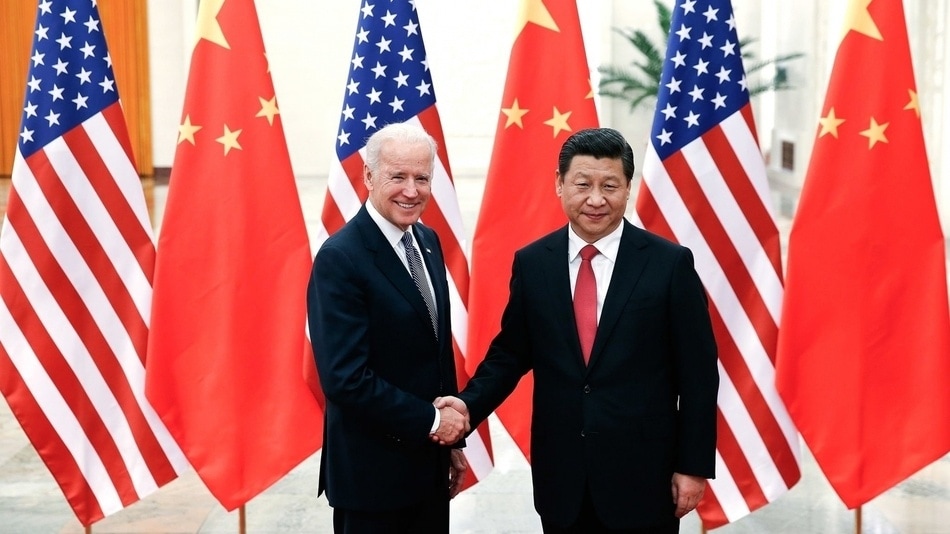 El entonces vicepresidente Biden y el presidente chino Xi Jinping se dan la mano en 2013. Eran otros tiempos.